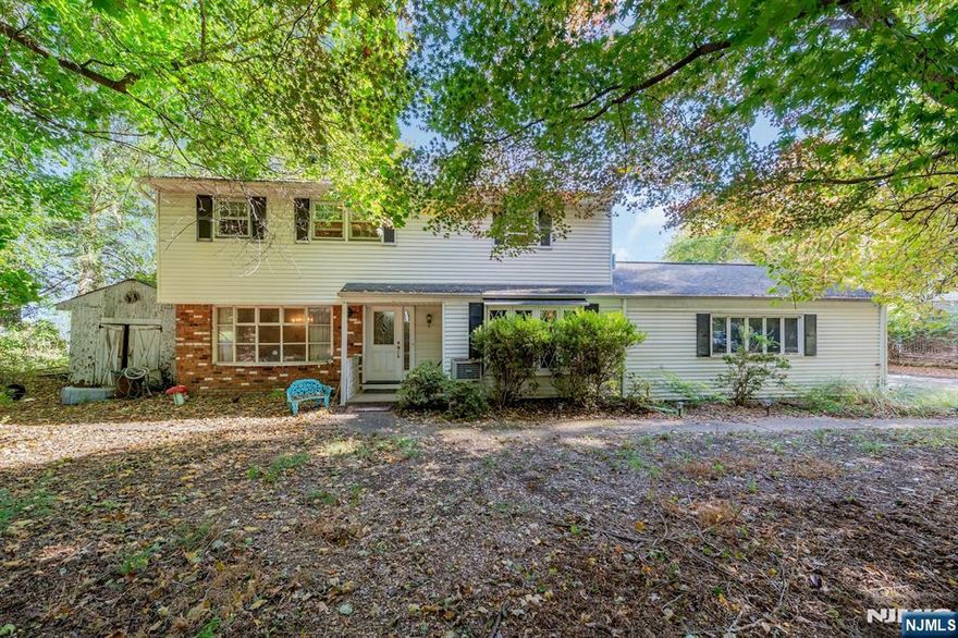 Nestled at the end of a quiet cul-de-sac, this 3-Bedroom, 2-Bath Split-level Home offers privacy, space, and seasonal views of the NYC skyline. Situated on nearly half an acre, the property provides ample outdoor space, complete with an in-ground pool perfect for summer enjoyment and entertaining. The home features a spacious layout with multiple living areas, offering great potential for customization to suit your personal style. Large windows invite natural light throughout, while the elevated setting allows for beautiful winter skyline views. Sold strictly As-Is, this property presents a unique opportunity for buyers, investors, or renovators looking to create their dream home in the desirable community of Allendale with such a unique secluded location.