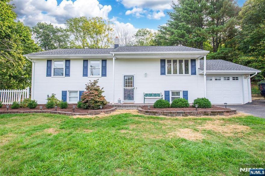 Welcome to this charming 3-bedroom, 1.5-bath home located in a desirable neighborhood. This home features natural light, an open, updated kitchen with granite countertops, stainless steel appliances, and sliders leading to a newly resurfaced deck ideal for entertaining or relaxing outdoors. The main floor is also complete with hardwood floors and brand new carpet in the bedrooms. The lower level is wide open, offering endless possibilities for a cozy den, home gym, or additional living space. Perfectly situated in the valley, this home offers the convenience of public utilities, central air, and natural gas hook up. Don't miss the opportunity to own this move-in-ready home in a sought-after location with traditionally high ranking school systems!