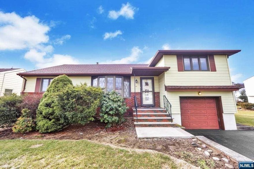 Ranch split initially constructed larger than building plans of neighborhood offers comfortable room sizes. Located in a gem area of Clifton. Quality construction built by mason for own primary home. Curb appeal invites you in. Main level offers sizeable Living Rm opened to full Dining Rm is perfect for entertaining; Oversized eat-in-kitchen allows enjoyable space for everyday dining and access to rear; Two full size Bedrooms and main FBth. Escape to the 2nd level to your private Master Bedroom with own FBth. 2nd level also has easy access to attic for plenty of storage. Full, Finished lower level has abundance of additional living space with large Rec Rm with dry bar, large laundry/summer kitchen, office, workshop and half bath has separate outside access. Yard has concrete patio to enjoy the outdoors. Pristine Hardwood Floors under carpet, C AC, Multi Gas heat, Newer 2 Car wide Driveway leads to Garg w auto opener, Newer Roof, Newer HtWtrHt, 1 Year AHS warranty incl & More!