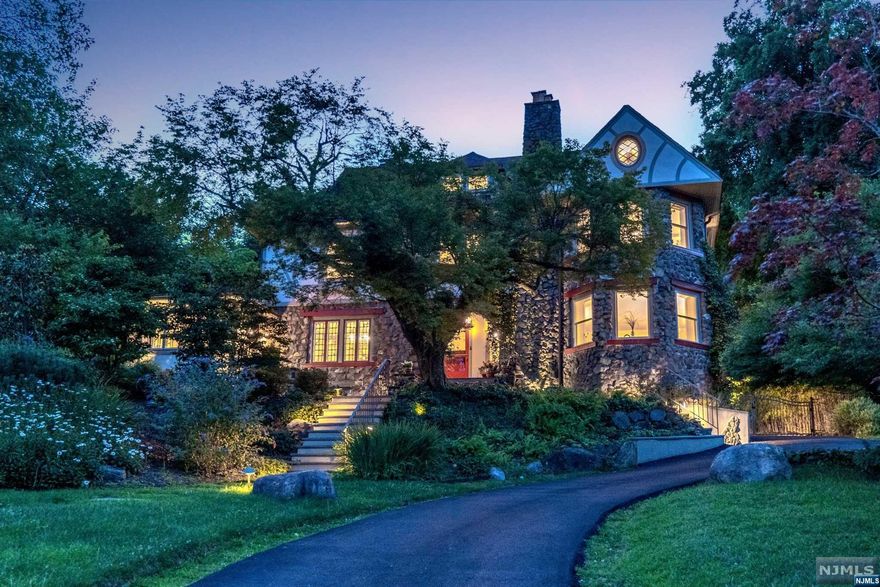 Step into history with this charming urban oasis, built-in 1897, featuring a unique blend of uncoursed local fieldstone and stucco. Meticulously restored over 20 years, it harmoniously combines timeless charm with modern upgrades. Historic detail abounds with detailed moldings, a triple stained glass window, stone walls, exposed brick walls, gleaming floors 5 fireplaces and a Family Room with NYC skyline views. Upgraded kitchen, spa like baths, updated HVAC, updated windows, and electric, provide ultimate comfort. NYC Midtown Direct train 2 blocks away. No car needed! A highlight is the chef's dream kitchen with Subzero fridge, Jennaire wall ovens, range, and wine fridge. Enjoy year-round views of the Manhattan skyline, daily sunrises, and sunsets, offering a serene escape from the city bustle. The gardens, designed by Richard Hartlage, boast unique plantings respecting the environment. A private oasis awaits, surrounded by lush "Yellow Bamboo." Indulge in the saltwater pool with