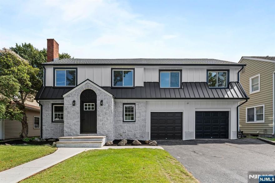 Borderline Paramus Stunner! This fully renovated and expanded single family gem sits on a 9,718 sq ft lot and showcases 4 bedrooms plus an office and 3.1 bathrooms. Step inside to a thoughtfully designed layout featuring a spacious living room, an oversized kitchen with a waterfall-edge quartz island, and a massive family/living room combo with tinted modern windows and direct access to a large deck overlooking the backyard. Designer light fixtures illuminate every space, while a stylish full bath completes the main level. Upstairs, youâ€™ll find four bedrooms including a serene primary suite with a luxurious double vanity bath and a perfectly sized bonus den. The fully finished basement offers a half bath, central A/C and forced hot air, a two car garage, and a driveway that fits four more vehicles. All just minutes from Westfield Garden State Plaza and major highways, an immaculate masterpiece ready to move right in!