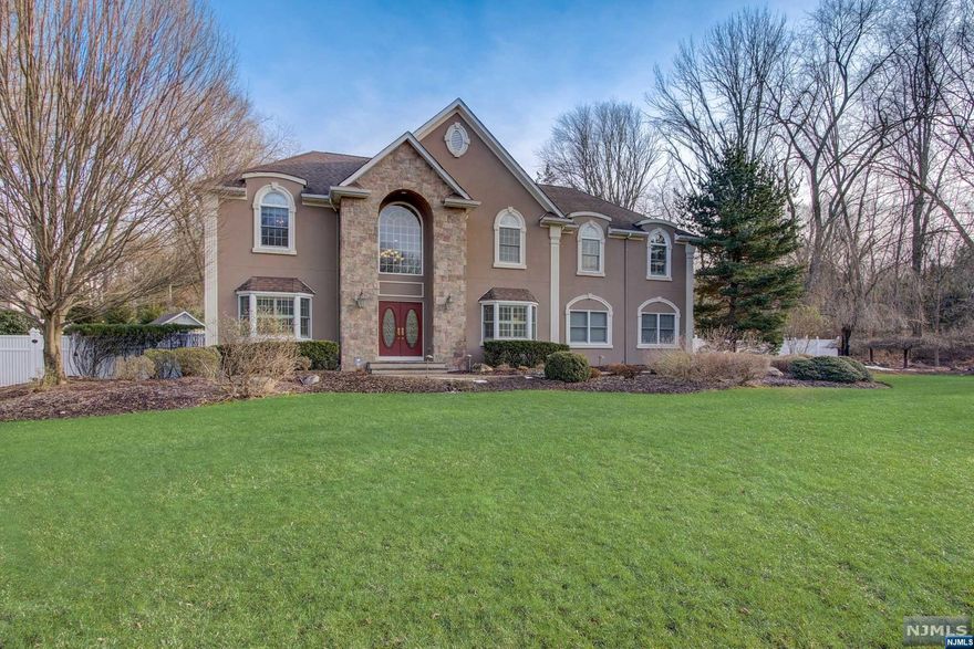 Welcome to the most luxurious home hitting the Oakland market! Located on the most desirable cul-de-sac in the prestigious Ramapo Reserve area, this 5,600SF colonial boasts captivating curb appeal at every turn highlighted by a private fenced yard, exquisite outdoor lighting, and significant outdoor living spaces including a new saltwater gunite pool with sundeck, fire pit and grilling station. Volume ceilings, quality millwork and light-filled open living spaces are immediately apparent upon entering the 2-story foyer. Convenient 1st-floor bedroom, great room with floor-to-ceiling windows & fireplace, modern and sleek eat-in kitchen, formal dining room and study/designated home office round out the 1st floor. Four sizable bedrooms on 2nd level with custom closet built-ins, including the primary retreat with vaulted ceiling, double-sided fireplace and spa-like bath. Entertainer's dream basement offers a rec space, wet bar, cedar wine closets, gym and full bath. Opportunity awaits!