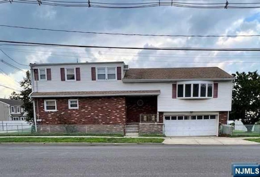 This 4 bedroom 3 bath 2 family home that sits on a 50x100 lot and taxes just under $10K. The first floor apartment has 3 bedrooms and 2 full baths, large living room, dining room and walk out to deck. The second floor apartment has 1 bedroom and 1 bath, living room with dining area and kitchen. There is also a large storage room that can be finished off into an extra room. Finishing off this home is a finished basement with laundry, utilities and access to the large 2 car garage. All the utilities are separate. SOLD AS IS