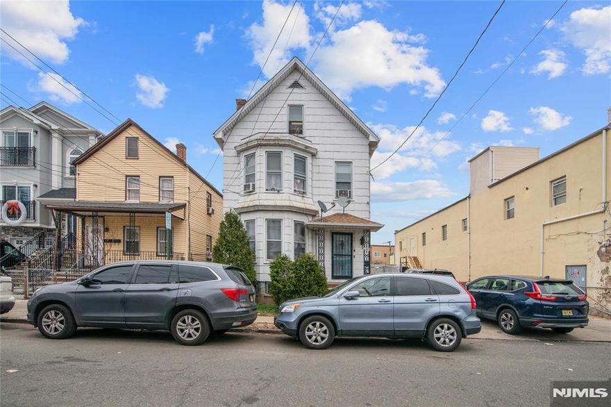 Legal 2 family house with a full finish attic and semi-finish basement. Located in the heart of Elizabeth near Newark Airport, all major highways and close to all Major transportation to NYC. Separate utilities and tons of potential.