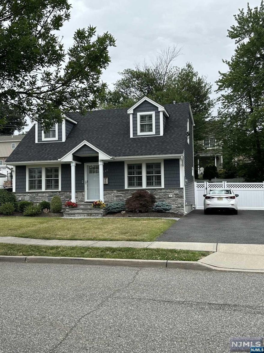 Meticulously Maintained and fully renovated in 2020. This turn key home features an open concept. The kitchen is equipped with all stainless steel appliances, Quartz counter tops, coffee bar, a large walk in pantry and window over the sink with a view of the large back yard. First floor bedroom can be converted into a dining room. Master bedroom with full bathroom and spare bedroom on second floor. Finished basement has a separate entrance with fourth bedroom, living space, laundry room and storage room. Fenced yard. Trex deck with hot tub and direct line gas grill. Driveway built to park 6 cars. AC, Hot Water Heaters and Electric all updated in 2020