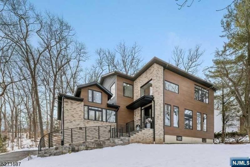 Nestled in the heart of Livingston, this modern 5-bedroom, 5.5-bathroom residence epitomizes luxury living. Spanning approximately 5,000 sf of total living space, this meticulously crafted home offers an unparalleled blend of modern and sophistication. As you step through the grand entrance, you're immediately greeted by the timeless allure of white oak floors, custom engineered floating stairs seamlessly leading you through the expansive living spaces. Bathed in natural light, the open floor plan creates an inviting atmosphere, perfect for both relaxation and entertaining.The heart of this home is undoubtedly the high-end kitchen, featuring top-of-the-line Viking and Miele appliances, custom cabinetry, and quartz countertops. Retreat to the luxurious master suite, where tranquility awaits. Boasting a spa-like ensuite bathroom with soaking tub and oversized shower, as well as a spacious walk-in closet, this private sanctuary offers the ultimate in comfort and relaxation.