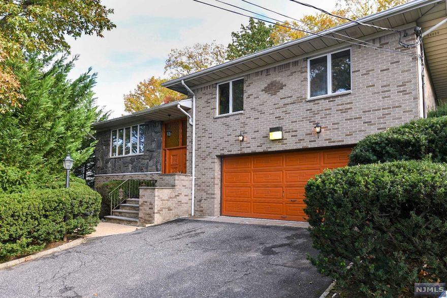 Prime location on a dead-end street in highly desired Englewood Cliffs just minutes from the GW Bridge and NY/NJ transportation. Large bi-level with fully finished lower-level walk-out. First level offers eat-in kitchen which opens to a family room with fireplace, large living room and dining room. Enjoy the stunning patio off the kitchen is outstanding for outdoor entertaining. The next level provides a main bedroom with full bathroom and two walk-in closets, two more bedrooms and a full bath. Hardwood flooring through out theses bedrooms. The finished lower level provides an additional eat-in kitchen, living room, bedroom, office, full bathroom, laundry/utility room and a two-car attached garage. Close to school, park and all amenities with low taxes.