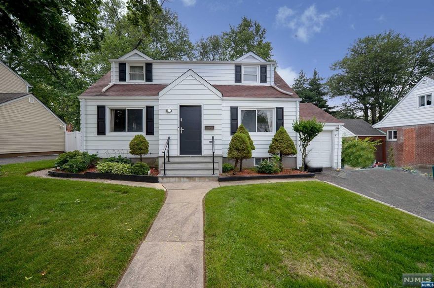 Welcome to this charming expanded Cape Cod home. This property is truly unique, as it showcases a perfect guest suite with a full and separate apartment on the first floor. As you enter, you'll be welcomed by an inviting entry foyer, a sun-filled living room, formal dining room, modern eat-in kitchen with S.S appliances and SGD to a gorgeous patio overlooking a serene backyard. On this level, you'll find two well-appointed bedrooms with tons of storage, one of the which is currently used as a huge walk-in closet. The 2nd floor features two additional bedrooms. The fully finished basement has been newly renovated boasting a rec room, a convenient kitchenette, laundry room and 1/2 bath combo. With its charming design, separate guest suite, and serene backyard, this cape cod home is perfect for those seeking a versatile living arrangement and a warm, welcoming atmosphere. Enjoy the convenience of nearby amenities, schools, shopping centers, and transportation options.