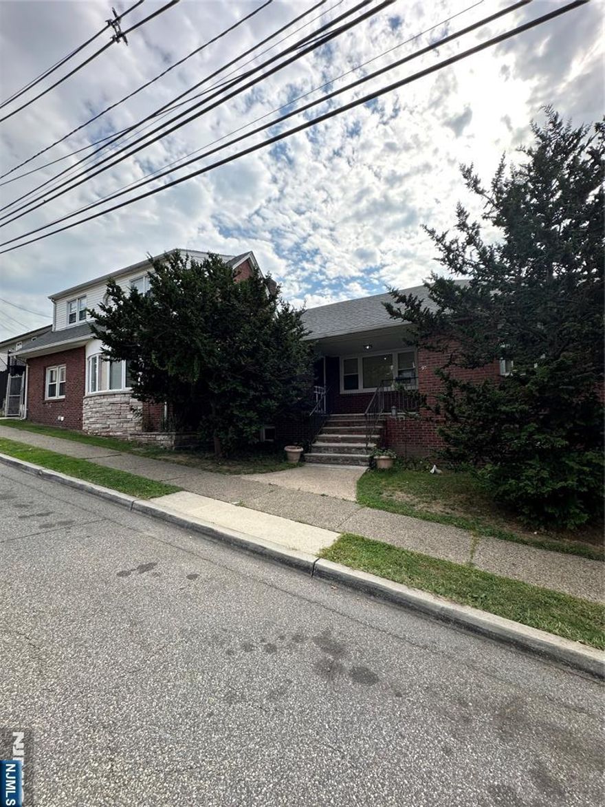 Welcome to 38 Malcom, a Corner Lot Duplex Style 2 Family Home in Garfield. Unit 1 consists of a Large Entry Foyer, Large Living Room, Updated Eat in Kitchen, Bedroom and Full Bath; 2 additional spacious bedrooms, on the second floor, completes this unit. Unit 2 has a beautiful updated Open Concept Living room/Dining Combo, Kitchen, Bedroom, Bath and a Loft Bedroom with Skylights. The property also features separate heat, gas and electric meters, Large 2 cars garage plus driveway parking for additional 4 cars, Brick exterior for easy maintenance, and outdoor patio space. Close to schools, shopping and transportation. Come take a look...whether you are looking to occupy the property or as an investment, this is the home for you! House will be delivered VACANT!