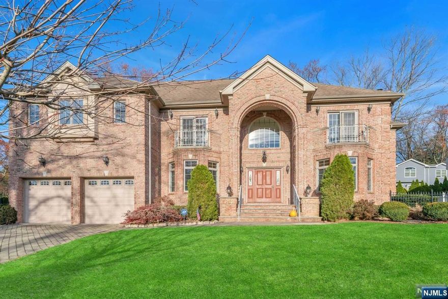 Experience luxury living in this exceptional 2005-built center hall colonial, with nearly 5000 sq ft of living space in the coveted East Hills neighborhood of Closter. This stunning residence gets an abundance of sunlight facing southwest and boasts timeless colonial style with its solid all-brick construction. 1ST FL: A grand 2 story foyer with sweeping staircase; Bright LR leads into the FR w/gas fireplace and SGD to fully fenced in yard; Large gourmet kitchen w/butlers pantry to DR;A guest BR and FB; 2ND FL: 4 spacious bedrooms, including 2 master suites with en-suite baths w/Jacuzzi and steam shower; 2 generously sized BR w/jack&jill FB; laundry room; BASEMENT LEVEL: home theatre area; large rec room; another large BR w/full bath; large utility room. Meticulously maintained, offering the perfect blend of elegance and comfort. Experience Closter's Blue Ribbon top rated schools; close to great parks, shopping, great restaurants and only 8 miles to Manhattan.