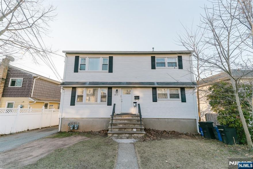Spacious and well-maintained, this beautiful 6-bedroom, 2-bath two-family home in Garfield, NJ sits on a quiet dead-end block, offering privacy and tranquility. The first unit includes a ground-level walkout, providing easy access and added convenience. Both units feature gleaming hardwood floors, updated kitchens with modern finishes, and renovated bathrooms for a stylish and comfortable living experience. A full basement offers extra storage or potential additional living space. Outside, enjoy a private backyard and a single-car driveway. Conveniently located near schools, parks, shopping, and public transportation, with easy access to major highways for a seamless commute. Donâ€™t miss this fantastic opportunity!
