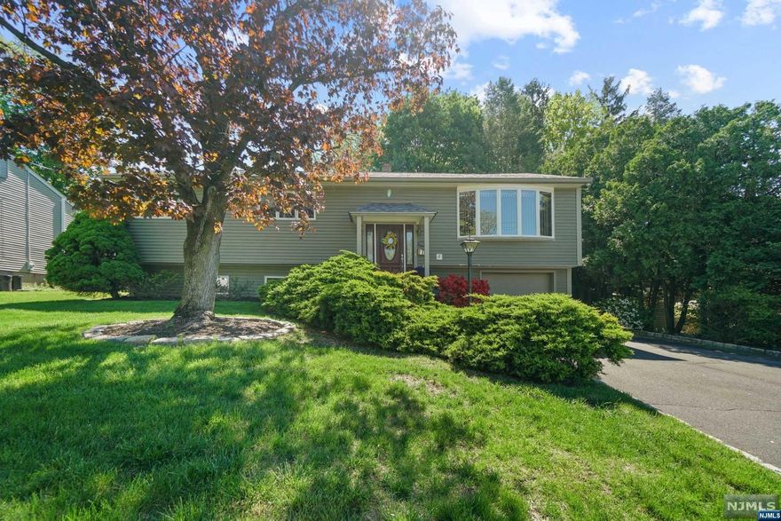 Move in Ready with Great Curb Appeal! Beautifully maintained and updated 3 bedroom two and a half bath home is located in a AAA Northvale residential location. Gleaming hardwood floors throughout upper level. Updated kitchen with Newer Stainless LG Appliances, greenhouse window over sink, granite countertops, Wine Cooler under counter. Open Flow makes entertaining a breeze. Modern and sleek full bath in hall, half bath in Primary Bedroom. Very spacious lower level family room (can easily add a fourth bedroom for extended family and still have a fam rm). Lower level has an updated full bath. Anderson windows with custom window treatments included. Composite decking with gas line for easy BBQing overlooks gorgeous green yard. Roof is approx 4 yrs. Alarm System, 2 zone heat, Central air condenser unit only 4 yrs.. Excellent K-8 School and NYC bus stop just a few blocks away. Make this beauty your home sweet home! Best & Highest Monday 5/22 @11AM