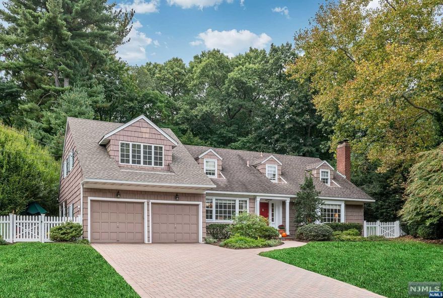 Nestled on one of Ridgewood's rare cul-de-sacs in a coveted neighborhood, this elegant Petersen-built home is all about lifestyle. The lush backyard with in-ground pool offers endless recreation and relaxation. Inside you will find well-proportioned living spaces with gracious architectural details throughout. The chef's kitchen features a stunning copper hood and flows to the breakfast room with sliders to back patios. A show-stopper, two-story Great Room with Fireplace and walls of windows that overlook the private grounds can also be enjoyed from the open library above. A banquet-sized Dining Room, expansive Living Room w/ Fireplace, Primary Bedroom & 2 Full Bathrooms round out the 1st Floor. Upstairs find 3 generous Bedrooms, a family Bathroom, Sitting Area & Library with beautiful views of the outdoors. Spacious basement with nice ceiling height and a two-car attached Garage complete this Ridge district oasis, within close proximity to all that Ridgewood has to offer!