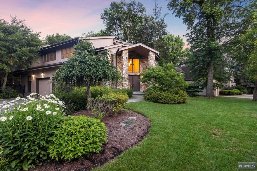 Beautiful contemporary smart home with private backyard oasis, featuring a heated gunite pool and spa with Jandi control system. Bluestone patio and walkways, outdoor fire pit, whole house generator. Hunter Douglas window dressings, soundproofed home theater room,alarm system, 8 zones of heat, 4 zones of central air, 4 Rainbird wireless rain sensor sprinkler system, central vac,2 car garage. The VIRTUAL TOUR link for this listing contains an enormous amount of relevant information including a comprehensive video tour with hidden features & room dimensions, written description, additional photos, floor plans, and a complete interactive 3D model of the home.