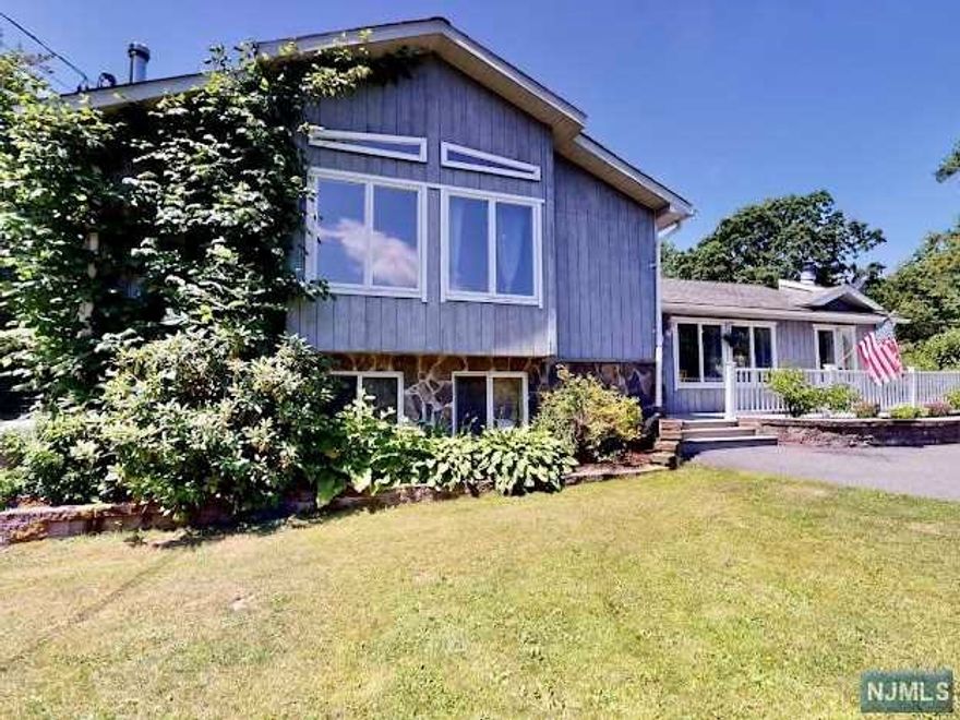 Welcome to this large 6 PLUS ACRES property with many Possibilities BACKING UP TO PARK LAND and surrounded by non developed wooded area on the left of the house... This home Features Large living room with a wood fireplace. Dining Room with sliders to a fabulous Deck to host many outdoor entertainment events, overlooking the Back Yard! Kitchen Has Granite counter, Custom wood ceiling, Soft close KraftsMaid Cabinetry, Skylight for lots of sun. The Kitchen has access to living and dining room. A few stairs up features 2 very large bedrooms with full Bath, A Master bedroom and a Master Bath an walk in closet. Lots of closet space throughout. The Basement is full Finished with 1/4 bth, Family room with a wood burning stove, Ceramic tile floors, a bedroom, storage closet, Laundry room, mechanicals which have New brakers 200 amp service, 300 gallon above ground outside oil tank, New well water Pump, a 2 year old New septic system, BONUS Solar panels with a 10 year left on lease