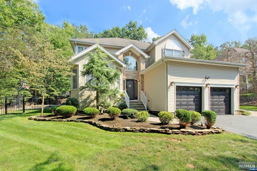 Minutes to UPPER MONTCLAIR Retail, Restaurants & Trains, This 2875 SqFt Custom Colonial On Large Private Lot Offers 5 Bedrooms, 4 Full Baths & 1 Half Bath Of Upscale Living! The Finished Basement Adds Approx 1,000 SqFt Of Finished Space With Wet Bar, Media Area, Office, Game Room, Full Bath & Storage Room! A Two-Story Foyer Welcomes You Into An Easy-Flowing Main Living Area Perfect for Entertaining. Formal Living/Dining Room; Large Eat-In Kitchen With Island Opens to Family Room With Cathedral Ceiling And Wood Burning FP; Powder Room; Laundry Room; Private BEDROOM With Full Bath & Private Entrance Complete The 1st Floor. The 2nd Floor Offers Large Primary Bedroom With 2 Full Closets & Large Ensuite Bath With Dual Sinks, Stall Shower & Jetted Tub. Three More Bedrooms & Full Bath Complete 2nd Floor. Party-Size Paver Patio, Half-Court Basketball Court & Landscaped Yard With Mature Trees. Sprinkler System & Security System. Fireplace, Flue, Chimney "As Is" With No Known Issues.