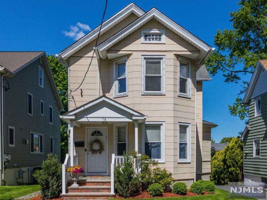 Charming Colonial Style home located in a Great neighborhood close to NYC train, schools, parks, town pool and shopping! This home is light & bright with all nice size rooms, great closet space, hardwood floors, formal Living Room, Dining Room, full bath & a Spacious Modern eat-in Kitchen with a door leading to a covered patio perfect for BBQing while overlooking the tranquil rear yard and one car garage! The Upper Level has 2 good size bedrooms and an updated bathroom with a Shower over tub and a linen closet. The lower level is a walk-out basement offering plenty of storage room, laundry & Utilities