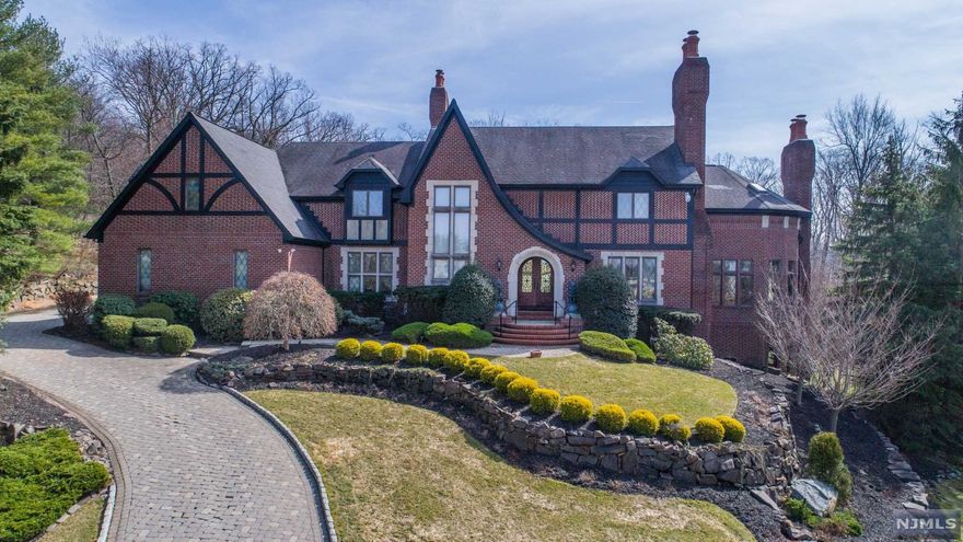 One of a Kind Spectacular Tudor-Colonial Situated on Desirable Cul-de-sac backing up to woodland property in Fox Hollow! Features Include: Two-story Foyer, Gourmet-style Kitchen open to Sunken Family Room surrounded by windows, Formal Living and Dining Rooms, Primary Suite w/ Sitting Room, Office, Dual Walk-in Closets & Lavish Bath, 2nd Floor Gym & Suana, Incredible Walk-out Basement with Full Wet Bar, Recreation Room, Lower Great Room, Home Theater & Full Bath! Resort-like Yard with Gunite Freeform Pool, Patio and Deck! Other Features Include: New High End Appliances, State of the Art Alarm/Camera System, Tankless Hot Water Heater & Whole House Generator. This Extraordinary Home and Location is sure to Impress!