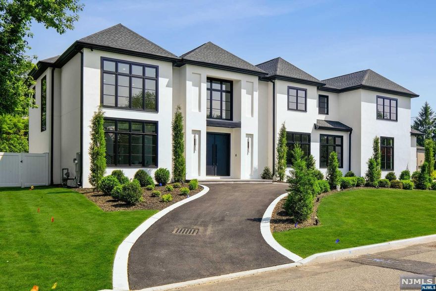 Welcome to your dream home! Over 10,000 sqft of pure luxury set on an oversized .4 acre property on prestigious Roberts Road. This new construction luxury home boasts a modern open layout that is perfect for entertaining. Soaring ceilings and large windows create an airy and open feel, while the gourmet kitchen, open to the family room, is a chef's delight. Step outside to your own private resort with a heated pool and waterfall, an oversized patio, and a convenient pool bathroom. The primary suite is an oasis of relaxation, including a fireplace, wet bar, two luxurious bathrooms and room sized closets. There are three additional bedroom suites on the second floor, as well as a main level guest suite. The lower level is an entertainer's dream complete with a custom bar, fully equipped theater, recreation rooms, a bedroom suite and a powder room. Amenities include an elevator, smart technology, camera system, radiant heat, generator and more!