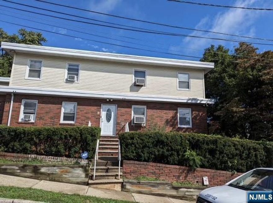 Spacious and bright first-floor apartment in a two-family home located in the Heights section of Hawthorne. Situated on a corner lot with a large private backyard surrounded by trees. The first floor offers a very spacious living room, two large bedrooms, a full bathroom, and a good-size eat-in kitchen. The fully finished basement provides additional living space, including a studio-style bedroom with a full bathroom and kitchenette (no stove), plus a separate large open area ideal for recreation, storage, or home office, along with laundry. Total of three bedrooms and two full bathrooms. Convenient location with access to local schools, public transportation, and major highways including Routes 208, 287, and 4.