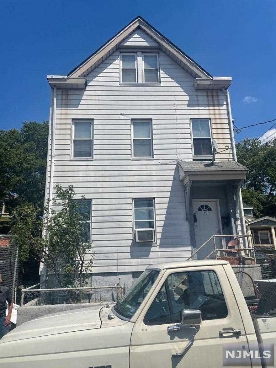 Great investment opportunity. Three-family. First floor offers two bedrooms, a living room, large eat-in kitchen and a bathroom. Second floor offers two bedrooms, a living room, large eat-in kitchen and a bathroom. Third floor is two bedrooms and one bath.