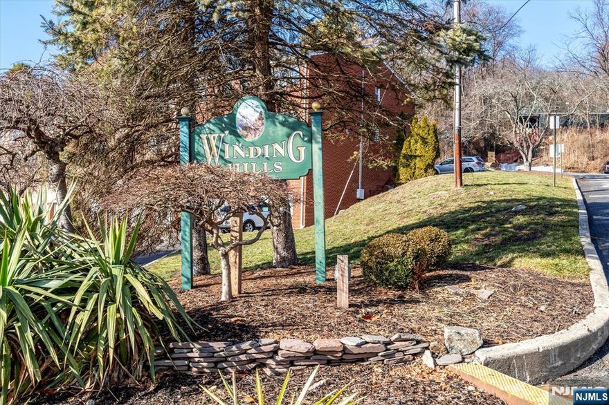 Updated second-floor 1-bedroom, 1-bath condo in the Winding Hills Condominium complex. Located at the top of the mountain, this unit offers a peaceful setting with access to walking trails throughout the community to enjoy the scenic lake views and woods. The 700 SqFt condo includes a galley kitchen with marble counter tops and and stainless steel appliances, dining area, spacious living room, bedroom with a retractable motorized projector TV screen, full bathroom with stand up shower and plenty of closets. Features include a large private storage unit and shared laundry in the basement of the F building, unassigned parking spaces and a pet-friendly complex.