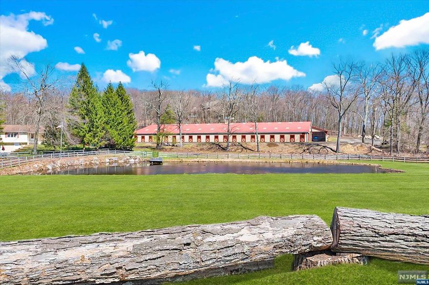 Hidden Acres Farm! Superb equestrian facility designed by internationally recognized trainer set on 10+ acres, located 35 miles from Manhattan & located btw I-80 & I-287. State-of-the-art barn offers 28 European-style matted box stalls designed w/ 2 wings flanking the large indoor arena w/ GGT high-performance footing, LED lighting, fly system & free-span trusses, heated viewing lounge, 3-bay grooming/wash stall area, laundry/feed rm, tack rm w/ custom lockers & bathroom. The 240' x 140' outdoor arena is a rider's dream complete w/ Derby Bank. There are 14 paddocks equipped w/ heated waterers. A 3 BR, 2 BA home w/ versatile office + two 1-BR apts on the LL. Addt'l staff housing incl a 1 BR apt above barn, plus 3-BR grooms' accommodations. This property has been rented @ $20K monthly making it an ideal investment. West Milford is known for its top vets & farriers, along w/ the best training facilities, horse shows & trail riding, incl neighboring Bubbling Springs, a 40-acre park.