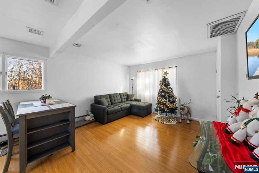 Welcome to this well-maintained two-family home in Garfield. Both units offer great space and convenience, perfect for owner occupancy or investment. Unit 1 features an open-concept living room, dining room, and kitchen with access to the deck and patio, two bedrooms, and a full bath. Unit 2 offers an open-concept living room, dining room, kitchen, bedroom, and full bath. The fully finished basement includes a large recreation room, a bonus room, a full bath, and a utility room. Generous multi-car parking is a rare and valuable feature providing extra comfort and flexibility. Come and see all that this property has to offer.