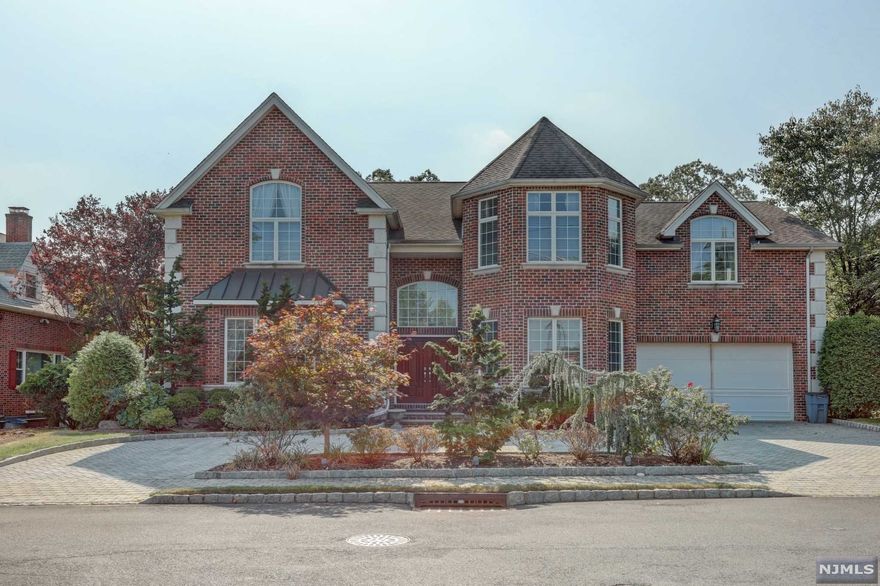 Custom built 5 Br, 4.5 Bth colonial in BLUFF section of Fort Lee. 1st Fl presents 20 ft+ high entry foyer, winding staircase, sophisticate FLR, FDR, Library/Den, Family Rm/FPL with high ceiling windows which bring the backyard & sunlight ADJ to gourmet kitchen with center island, breakfast area access to private garden, mud room/laundry room, professionally furnished 2 car garage. 2nd Floor features the Master BR suite with octagonal ceiling, sitting room, marble Master Bth with 2 separate vanities, his & her California walk-in closets. Three additional en-suites and 2 FBATH. Full, finished basement offers spacious REC Room, Gym, Bonus Room, BR/Bth. This exceptional home is presenting circular driveway, 6 zone HwBb Heat, 3 zone C/A, hardwood floors throughout, ample storage space.Convenient location, close to NYC transportation and shopping. Short sale. buyer responsible for offset negotiation fee of up to $6,000 of purchase price to effectuate mortgage holder's consent/approvals.