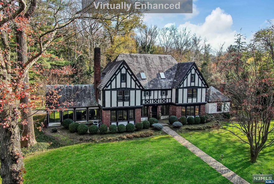 Spectacular park-like property just minutes from NYC! 5 Bedroom, 3 1/2 Bathroom Tudor style home on close to 2.5 acres (approximately 280 x 382). Recently refinished wood flooring and new carpeting. The home floods with natural light and features hardwood floors, three fireplaces, tons of character and a renovated kitchen open to the family room. Pool, cabana, 5 Car Garage and generator. Do not miss the chance to own this amazing property in the desirable town of Demarest with it's award winning schools, parks, library, art gallery and nature center. There is nothing like this meeting and property in the Northern Valley!