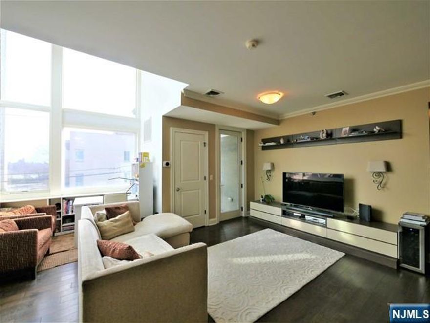 Discover a Rare Find in Cliffside Park!!! An Impeccably maintained 2Br/2Ba condo that exudes style and comfort. This unit, with its spacious open layout, boasts high ceilings and oversized windows that flood the space with natural light. The chef's kitchen, featuring stainless steel appliances and granite countertops seamlessly blends with the hardwood floors and abundant closet space throughout the condo. Enjoy the the convenience of an in-unit Washer & Dryer, as well as serenity of a balcony. The vibe here is simply unmatched. Prime Location: just steps away from everything you need - transportation to NYC, Shopping, Fine Dining, Entertainment and much more. This is truly a Must-See property that wont last long!