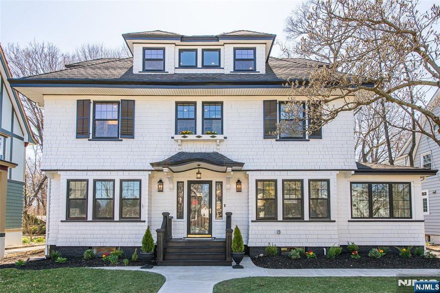 This meticulously renovated 5-bed, 4.5-bath Center Hall Colonial in Erwin Pk blends elegance with modern sophistication. The open concept main floor integrates historic details with contemporary updates. The living rm, with a wood-burning fireplace & French doors to a private den, offers yard views, while the dining rm & breakfast bar invite formal & relaxed entertaining. The custom kitchen, with high-end appliances and ample storage, steps down to a family rm with yard views, a mudroom, a rear deck door, and a powder rm. The 2nd floor primary suite features a walk-in closet & a luxurious bath with a large shower for 2. The 3d floor includes a full bath & flex space for 2 bedrooms, a home office, or nanny suite. The basement features a family rm, exercise rm, wine rm, full bath, a & laundry rm. The deep yard, with a manicured lawn and custom lighting, is perfect for garden parties & star-lit evenings. Additional features include 2-zone A/C, irrigation, and proximity to NYC transit.