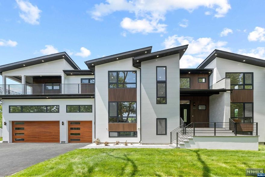 The pinnacle of modern living arrives - BRAND NEW construction built by award-winning NJGCB, located on a desirable West side cul-de-sac, steps to Sirianni Park. Discover this exquisite 7-bedroom, 6.5-bath haven, spanning 7,400+ sf on all flrs. Double door entry foyer w soaring 18' ceilings, modern living & dining rms, European tilt & turn windows,open great room w frplce, stunning chef's kitchen w full quartz backsplash & waterfall island & Sub-zero/Wolf appliances,1st flr en-suite & 3-car garage w 15' ceiling for a lift. Ascend the red oak open riser staircase to the private primary suite w a bespoke WIC, spa bath & open lounge balcony to enjoy morning coffee. Find 3 addl large bedrm en-suites & laundry rm on the 2nd flr. The walk-out lower level offers a sauna, theater, gym, office, large rec area & 6th/7th bedrooms. Revel in modern aesthetics w contemporary brilliance sitting on a RARE oversized 13,000 SF lot!