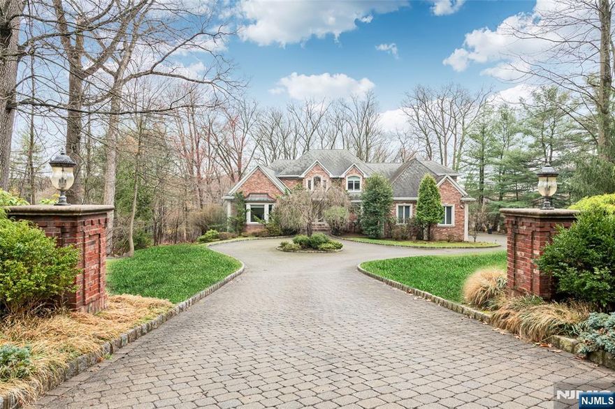 Welcome to this gorgeous, custom-built brick colonial nestled on 2 serene acres in the coveted High Ridge neighborhood, known for its large lots and private retreats. Built in 2001 with the exceptional craftsmanship of Leonard Developers, this home offers a modern floor plan with sunlit rooms, an elegant 2-story foyer, and an oversized gourmet kitchen with a dining area that overlooks natural views. The soaring great room adds a sense of grandeur, with a floor-to-ceiling stone FPL, while the 1st floor primary suite provides convenient one-floor living. Enjoy easy access to a laundry room, plus a versatile fifth bedroom or office. The upper level offers 3 spacious BRs including a junior suite, abundant storage space, and an unfinished section perfect for expansion. The walk-out lower level is a blank canvas for more than 3,000 SF of addit'l space, already complete with an FPL and bath. The veranda is ideal for entertaining while overlooking the private, tree-lined property.