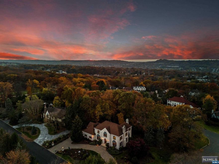 Introducing The Timeless Classic House at Bradford Estates situated a few blocks to Upper Montclair by E Bradford Ave & Highland Ave close to Upper Mountain Train station 20 miles to NYC. Exterior features a custom block paved circular driveway with 2 car attached garage. This custom-built Center Hall Colonial with architectural details - arch entry ways throughout. Over approximately 5000 + SF/1885 SF finished basement offers oak hardwood flooring, 6 BR, 5 full baths & 1 half bath, custom woodwork detail. The kitchen w/ separate seating area offers custom cabinetry, granite countertops, SS appliances (less 10 years) & center island leading into skylight solarium w/ magnificent views of the rear paved patio / backyard. 1st flr: guest BR w/full bath, mudroom & landscaped grounds.