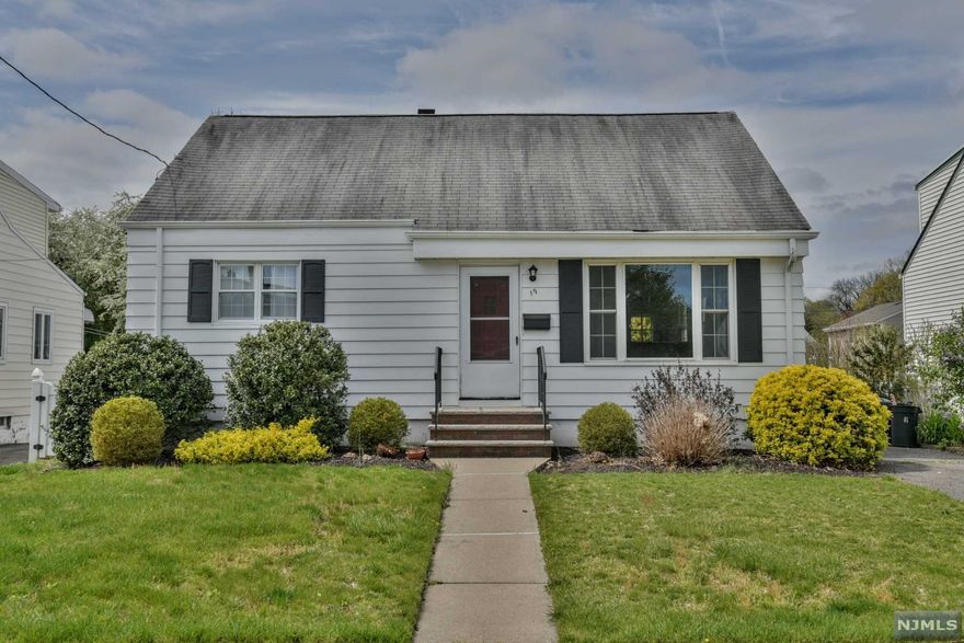 Welcome to this charming 3 Bedroom home with an extra large, newly finished Primary Bedroom with Office/Sitting Room on the 2nd floor. Be the first to enjoy the renovated kitchen customized with granite countertops, a breakfast bar, and brand new SS Oven/Stove, Microwave and Dishwasher. With gleaming hardwood floors throughout, the first floor offers a living room/dining area, two nice sized bedrooms and a full bath. A full basement with a new water heater, new sump pump and washer/dryer hookups is ready for your finishing touches. Barbecues await in your fenced in yard equipped with a sprinkler system to keep your lawn plush and green.