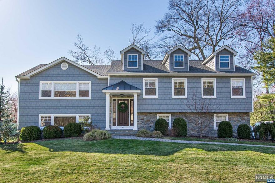 Be Wowed! COMPLETELY RENOVATED this HGTV 4 Bed, 3 Bath CUSTOM BI-LEVEL boasts 2900 + Sq. Ft of living space. Located on .35 level acres in DESIRABLE COLLINS. HIGH Ceiling truly OPEN CONCEPT includes White Kitchen w/large center ISLAND open to Dining & Living Rms w/ GAS FIREPLACE and SLIDER to TREX Deck overlooking playable backyard. This level also features 3 BED and 2 Full Baths inc. Primary en-suite. Ground level features 4th Bedrm, Full Bath, COZY Family Rm & All Season Sunroom with another GAS Fireplace and Walkout to Stone Patio Great layout for entertaining! MOVE RIGHT IN and ENJOY LIFE in STYLE!