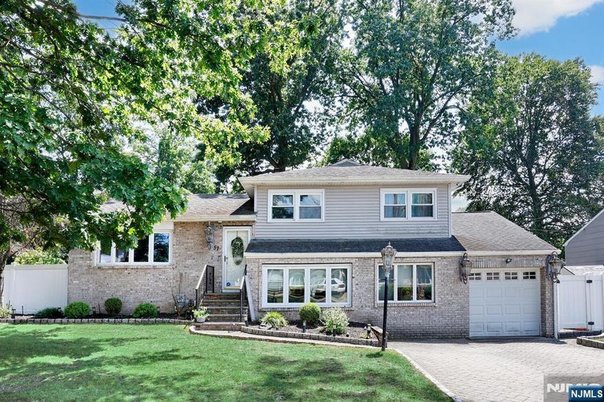 Welcome to this beautifully maintained four-bedroom, two full bath split-level home, perfectly situated on a desirable street. Step inside to discover hardwood floors throughout and a spacious layout designed for comfortable living. Enter into the living room with gas fireplace, formal dinning room, large eat-in kitchen with cathedral ceilings and lots of light offers ample room for cooking and entertaining. A unique highlight is the ground-floor family room with bedroom and full bath with its own private entranceâ€”ideal for guests, extended family, or a home office. The finished basement provides additional living space, perfect for a playroom, gym, or media room. Don't miss the opportunity to make this versatile and inviting home your own! According to Dumont tax dept the taxes will be reduced. Best and Final By Monday Aug 11th at 2:00 pm