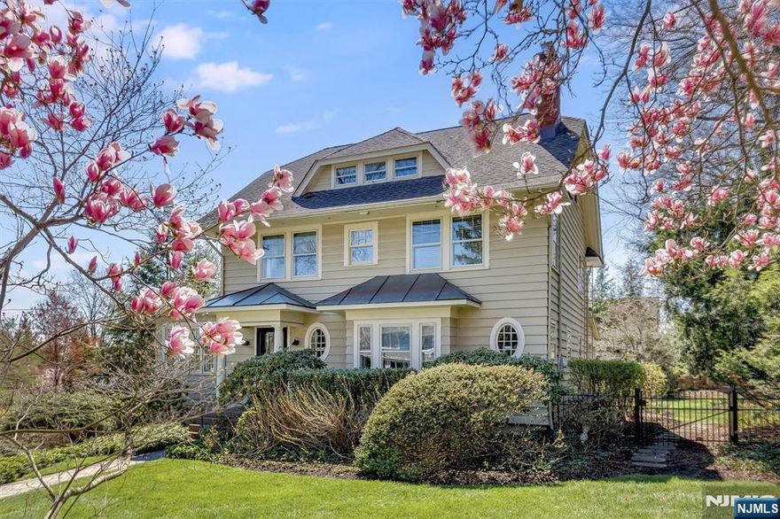 Elegance, history, and thoughtful design converge in this one-of-a-kind Maplewood treasure uniquely conceived by Edward C. Balch, the visionary developer known as the "Father of Maplewood." This lovingly curated 4-bedroom, 3.5-bath Center Hall Colonial has been beautifully updated while honoring its remarkable origins, showcasing exquisite millwork and moldings, gleaming hardwood floors, and an alluring screened-in back porch. Perfectly suited for entertaining, the eat-in kitchen features honed quartzite countertops and stainless steel appliances, all within a layout that flows effortlessly from room to room. The second floor is anchored by a gracious primary suite featuring a generous walk-in closet - easily converted back to a fifth bedroom - plus a beautifully updated primary bath with stunning tile work. Two additional bedrooms and a full bath complete this floor. The third floor is a retreat unto itself, with a spacious bedroom, full bath, and expansive lounge area bathed in natural light. The lower level features a dedicated gym, craft room, and generous storage, with endless potential for a media room. French drains and sump pumps offer added peace of mind. All of this, just two blocks from vibrant Maplewood Village with celebrated cafes, restaurants, boutique shops, and a direct NJ Transit train to NYC.