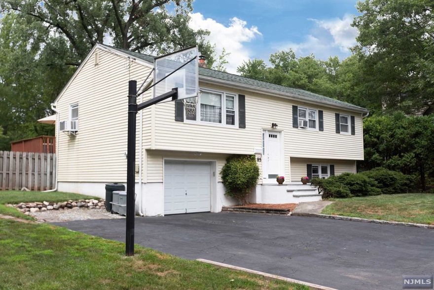 Welcome to this beautiful Bi Level home located on a tree lined dead end street in the desirable town of Harrington Park with award winning schools and sought after desirable community. Updated kitchen with granite countertops and stainless steel appliances. Breakfast bar. Hardwood floors throughout. Good size bedrooms. Updated bathrooms. Primary bedroom with Primary bathroom. Ample closet space. Attic with attic fan. Forced air heat. Spacious lower level with tiled floor and sliding door to patio. Laundry. Washer/dryer 2022. Additional storage space. Attached garage. Driveway fits 4 cars. Roof 2016. Water heater 2021. Expansive, flat backyard. Perfect for entertaining. Close to transport, schools, parks and shopping. Truly a fantastic opportunity. Not to be missed!