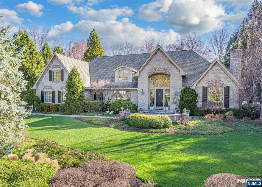 Bewitching Custom Cotswold Estate constructed by renown builder John Avanzato for these original owners in 1997. Fall in Love with this enchanting home with Scenic Water Views from entire rear of home. Meander through a plethora of winding paver walkways, terraced patios, and romantic sitting areas surrounded by gorgeous flowering foliage. Delight in the Luxurious Private Pool and secluded Spa overlooking this captivating property. Elegant 1st Fl Primary Suite exits to the rear yard. Additional En Suite 1st Fl BR w/French Doors to exterior. 2nd Primary En Suite Bedroom with Sitting Rm on the 2nd floor. Elegant Sweeping Stairway to the Front and lovely stairway to the the rear. Architecturally Delightful Rooms & Living Spaces. Incredible Library, Living Room & Great Room with 3 Tastefully Elegant Fireplaces. Enchanting Voluminous Breakfast Rotunda with water views. Soaring Pella Windows throughout. There is so much to love about this home. We invite you to visit and see for yourself.