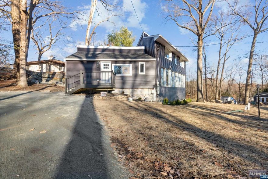 Custom built & fully renovated lake house with tons of light on a double lot and seasonal lake views.1st floor primary BR with full bath.Super large kitchen with custom cabinets,& exposed wood beams.2nd floor features 2 bedrooms and large bath.There is a walk out basement to level yard and new deck.Home features NEW septic,plumbing, electric, roof, siding, heat, and AC.There is nothing to do but move in.Cranberry Lake community offers a host of activities inc Club house and 2 beaches with life guards. Stocked lake for fishing. Paddle boards, Kayak, motor boat and jet skis are some of the area activities as well as hiking, biking and exploring nature. Join the area clubs and swim team. Yearly events are hosted building a lake lifestyle for all ages to enjoy. Just a short 50 mins to NYC. Ten minutes to NJ transit train. Minutes to NJ transit bus station at the lake club house entry and minutes. PRICE REDUCTION. PRESENT ALL OFFERS!