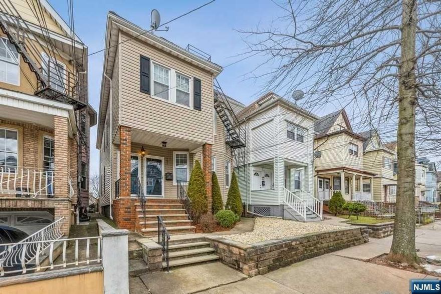 Welcome to this beautifully updated, well maintained 2 family located in Elizabeth, NJ. In this lovely home, you will find 2 bdrms, 1 bath in the first unit, while the second unit has 3bdrms, 1 bath. Finished attic has living space, full bath and flex space to use as you see fit. Finished basement also has spacious living area with bar, storage and laundry. Both units were brought down to the studs and renovated in 2009 with high end finishes such as cherry wood cabinets, granite countertops, beautiful hardwood flooring throughout, and gorgeous tiling in kitchen/bathrooms. There is also tons of storage and charming molding/framework that surrounds the doors and windows which are also newer. Relax in the spacious fenced in backyard which extends the remaining length of the lot to create your own oasis. Look no further to purchase a beautiful turn key home that has been loved and cared for throughout the years. Close to all major highways, shopping, restaurants and transportation