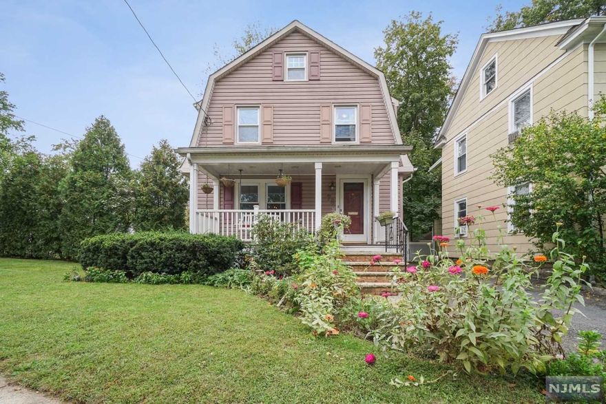 WELCOME TO THIS CHARMING DUTCH COLONIAL WITH FRONT PORCH. FIRST FLOOR HAS A LIVING RM, DINING RM AND MEIK WITH BLEACHED OAK CABINETS AND STAINLESS STEEL APPLIANCES. SECOND FLOOR HAS 2 GENEROUS SIZED BEDROOMS THAT MAY BE CONVERTED BACK TO 3 BEDROOMS AND LARGE FULL BATH.WALK UP TO LARGE FLOORED ATTIC. PARTIAL FINISHED BASEMENT HAS REC ROOM AND LAUNDRY, PROFESSIONAL LANDSCAPING, INGROUND SPRINKLERS, CENTRAL A/C AND OUTDOOR DECK COMPLETE WITH BUILT-IN BAR AREA MAKES THIS HOME PERFECT FOR ENTERTAINING AND EVERYDAY LIVING! HOT WATER HEATER, FURNACE AND A/C ALL DONE BETWEEN 2015 TO 2017. FENCE IN 2019. ROOF, DECK AND SHED IS "AS IS" . CLOSE TO TOWN, SCHOOLS AND NYC TRANSPORTATION.