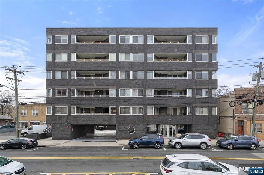 Welcome to this beautifully renovated top-floor corner unit at The Regency, offering bright, spacious living in a prime Cliffside Park location. This updated home features refinished hardwood floors throughout and a well-designed layout filled with natural light. The inviting living room includes custom built-in shelves and a glass door that opens to a private terrace, perfect for relaxing or entertaining. The modern kitchen is equipped with granite countertops, stainless steel appliances, and new range and microwave oven, combining style and functionality. This residence offers a spacious primary bedroom with a walk-in closet and an updated en-suite bath, along with a second bedroom with fully renovated bathroom. Additional highlights include in-unit washer and dryer and one indoor garage parking space. Ideally located with public transportation right in front of the building, and just minutes from markets, shops, restaurants, and cafes, this home offers both comfort and convenience.