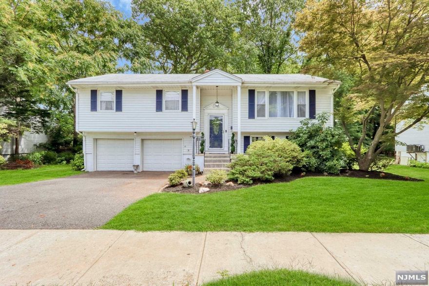 Beautiful move-in ready 4-BR home with open floor plan in the heart of Westwood. Large and bright living room open to dining room. Immaculate kitchen featuring large center island, granite countertops, custom white cabinets and stainless steel appliances. Large primary bedroom with updated Jack-and-Jill full bath. Two additional spacious bedrooms complete the main level. Walk-out lower level offers an expansive family room, large bedroom, updated full bath, laundry room and access to a two-car garage. Lush, professionally landscaped property including a large back yard with expansive deck- great for entertaining. This is a must see home.