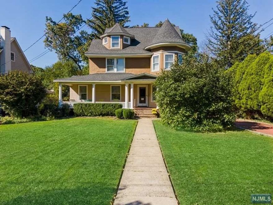 Queen Anne Victorian rests on over third acre of prof. landscaped property just short stroll to Watchung Plz's trains, bus & restaurants.Sprawling front porch greets you & your guests & leads to main level showcasing stunning original wood details, hardwood flrs, soaring ceilings, stained glass & lots of sunlight. Foyer is flanked by a cozy FR with French doors & fireplace & elegant LR which flows seamlessly to DR with wb fireplace & beautiful wood details. Updated kitchen has breakfast area & discreet powder. Laundry is also conveniently located on 1st flr. A beautiful staircase with wainscotting & stained glass leads to 2nd level offering 3 generous BRs including Primary BR with lots of closet space & ensuite bath with jetted tub & separate shower. 3rd level has 2 BRs, full BA & sitting rm. Basement has rec rm, work shop & tons of storage. Enjoy al fresco dining from large Trex deck which over looks deep back yard. Legal 2 BR carriage house w washer/dryer was updated in 2021.