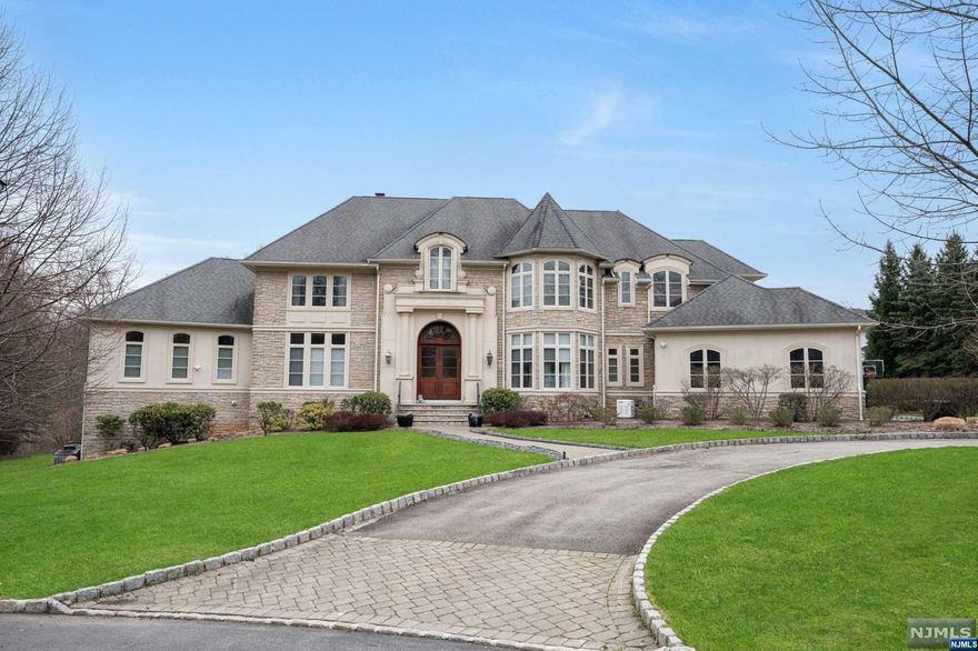 Nestled on nearly two-thirds of an acre of stunning property, this remarkable custom colonial boasts 8 bedrooms 5.2 bathrooms and sits on a private cul-de-sac, offering the epitome of luxury living with every conceivable amenity. This exceptional home spans 6,500 square feet of opulent living space, complemented by an additional 3,800 square feet in the walkout lower level, featuring a second gourmet kitchen, exercise room, rec room, and 2 bedrooms on the lower level. The designer white kitchen showcases furniture-quality cabinets, Calcutta Gold marble counters, and high-end stainless steel appliances, with a butler's pantry leading to the formal dining room. The master suite boasts a gas fi replace, two oversized walk-in closets, a laundry closet, a luxurious master bath, and a separate sitting room with 2 additional custom closets and French doors leading to a private deck. Pella Architect Series windows, a bluestone patio overlooking an expansive bi-level backyard, heated pool