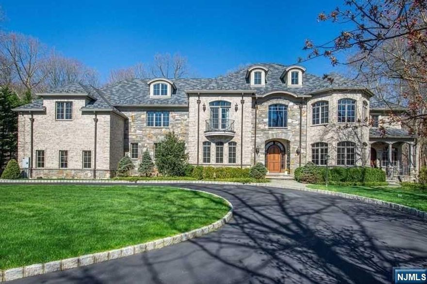 Welcome to Bear Rock Estates! This custom estate was built with the finest taste, with no expenses spared. Three levels of luxurious finishes imported from all over the world. Enter through the grand driveway gate and into a serene paradise, sitting on 2.8 acres at the end of a cul-de-sac, flat land with your own stream backing up into state land; a nature lovers dream. 6 bedrooms and 8 baths, 4-car garage. Harmonious ambiance in the whole-house built-in speakers, Lutron lighting system, Elevator to all 4 floors, electronically wired shades, radiant floor heating, 10ft ceilings. Relax by one of the 5 fireplaces, each meticulously crafted to add warmth and charm to every room. The heart of the home; the custom kitchen, featuring top-of-the-line Poggenpohl cabinets and high-end appliances. Entertain with ease in the walkout basement, future home theatre and wine room ready to be finished. Step outside to find backyard surrounded by lush landscaping, creating a serene outdoor oasis.