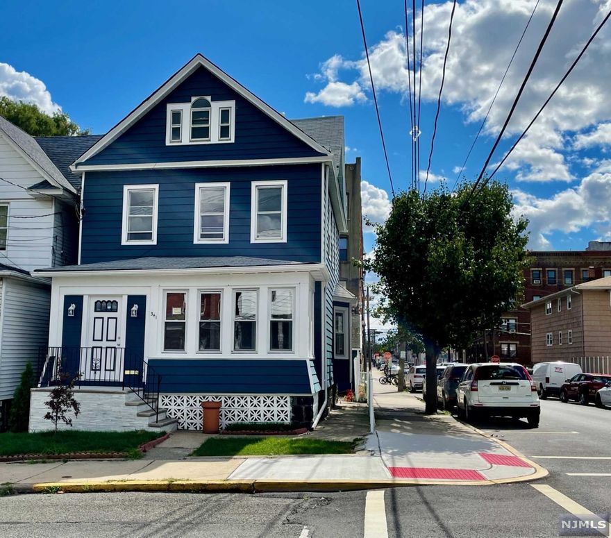 Located in the highly coveted Woodcliff location of North Bergen is this 10 room, 3.5 bath colonial, nestled on a corner lot with 2 garages and lovely landscaped backyard. Enter through a bright and sunny enclosed front porch that leads into a foyer with an elegant Italian marble floored half bathroom for guests, formal Living Room and Dining Room leading into a renovated eat in kitchen exiting to a mud room and lovely backyard with a southern exposure and a 2 car garage. The upper two levels offers 5 bedrooms, 2 full baths and office space. This home has been completely upgraded with individual Central Air Units, Forced Hot air units and genuine new hardwood floors throughout the home. The basement is finished with ceramic floor tiles, a french drain ( Not a drop of water throughout Hurricane Ida) and an elegantly appointed full bathroom.